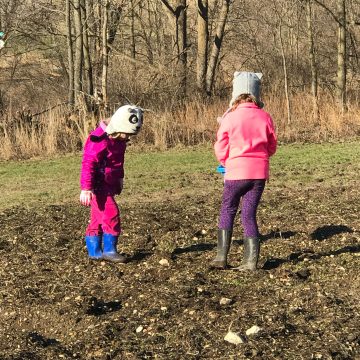 Children playing outside in the garden.